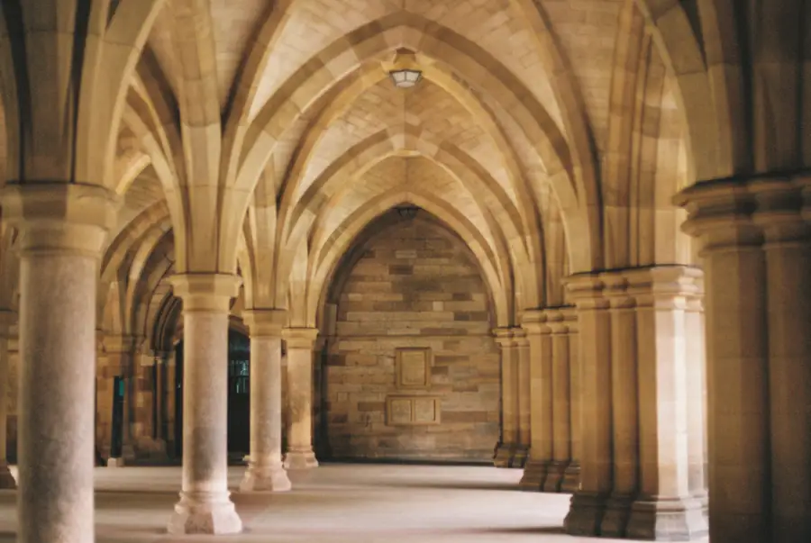 A vaulted stone corridor with warm light